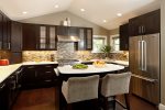 Fully equipped kitchen with necessary cooking utensils, granite countertops